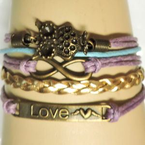 . Multi- Strand Bracelet Multiple colors, charms